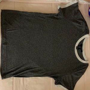 grey crew neck shirt.